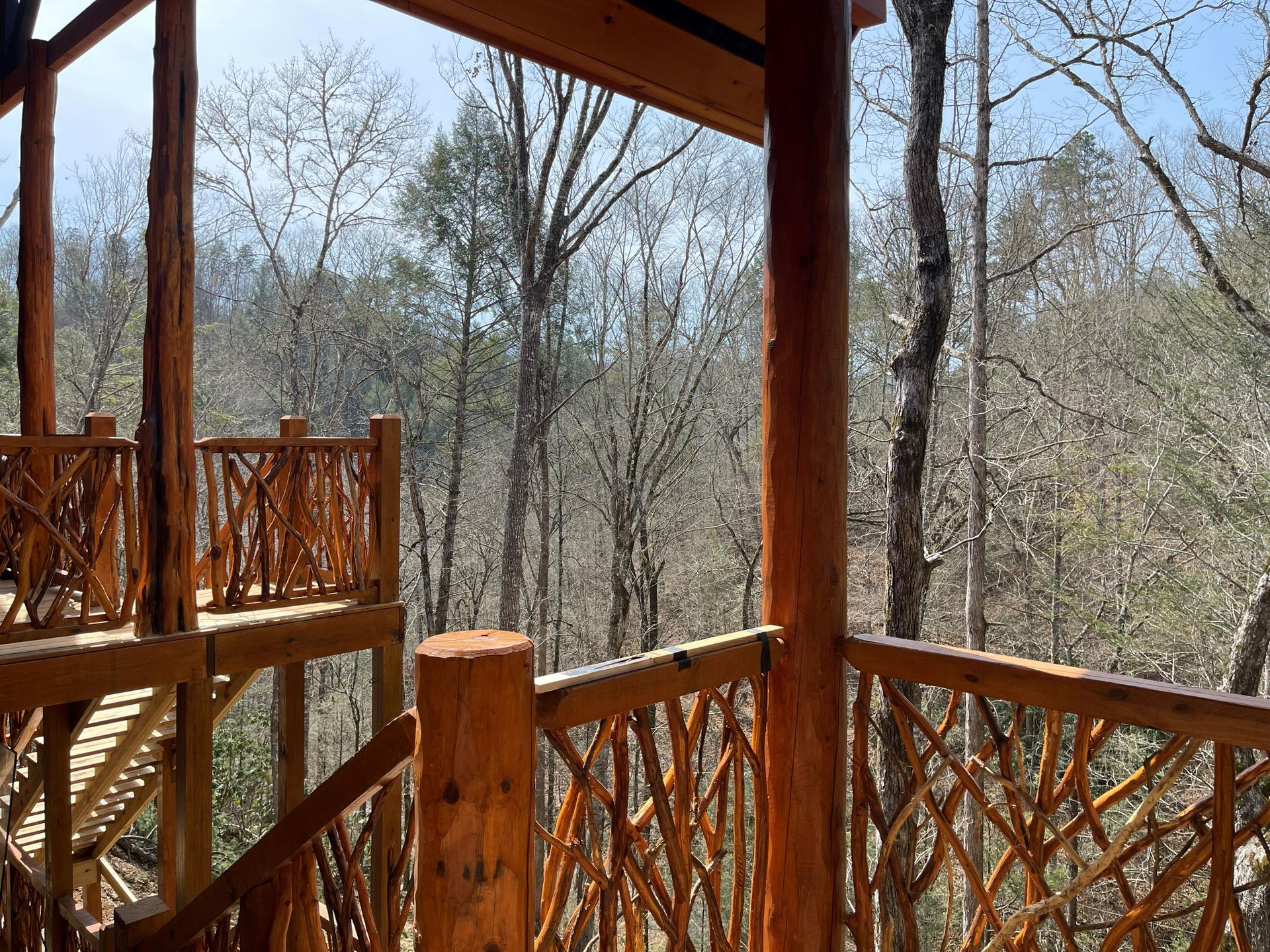 Step onto your private deck and breathe in the peaceful forest air while enjoying serene woodland views.