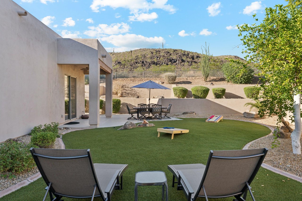Relax on the east patio with seating for six, admire mountain views, and challenge friends to cornhole