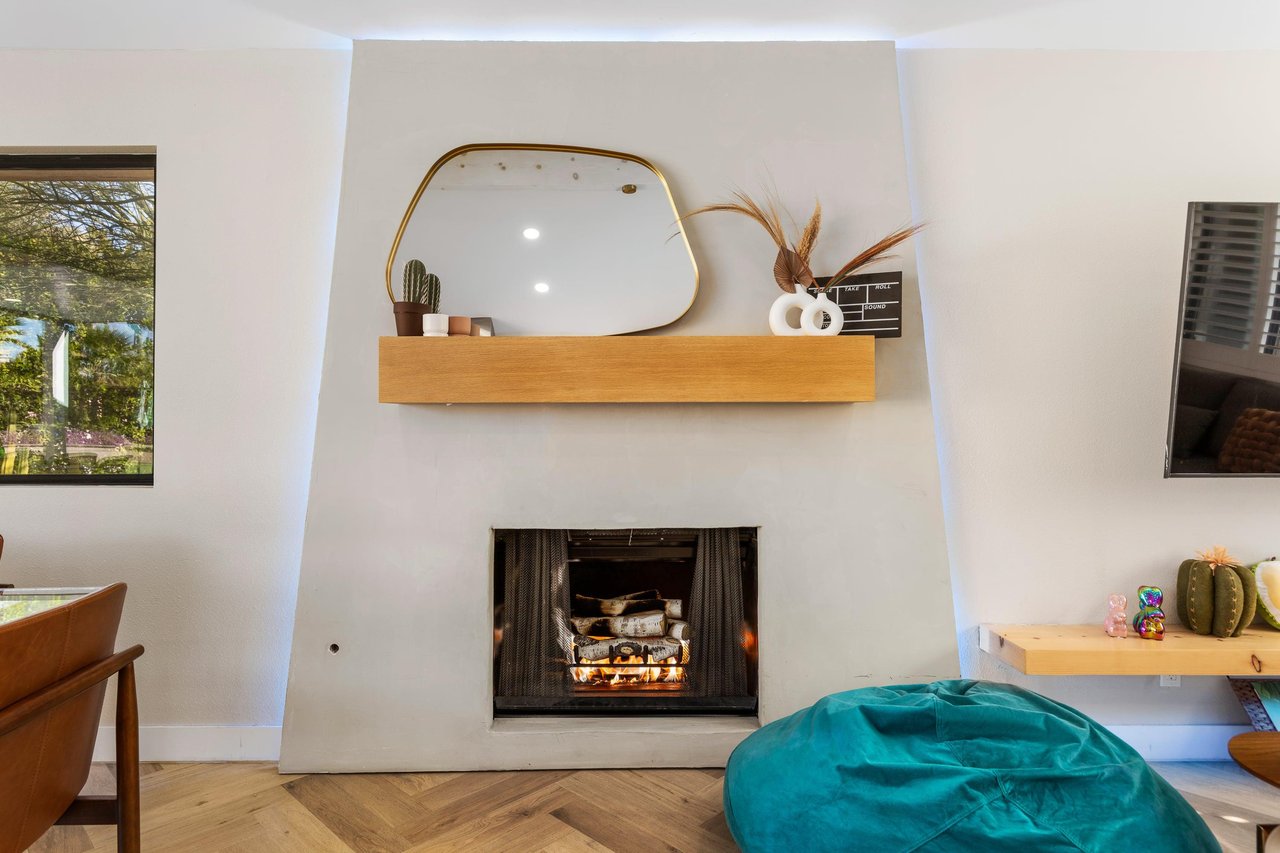 Gather around the fireplace with a glass of wine