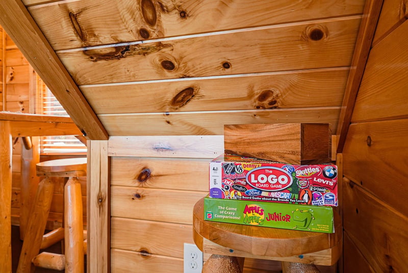 A cozy knotty pine loft space awaits with board games ready for family fun.