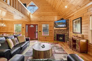 Cozy up by your crackling fireplace in this stunning log cabin retreat, where rustic charm meets modern comfort for your perfect getaway.