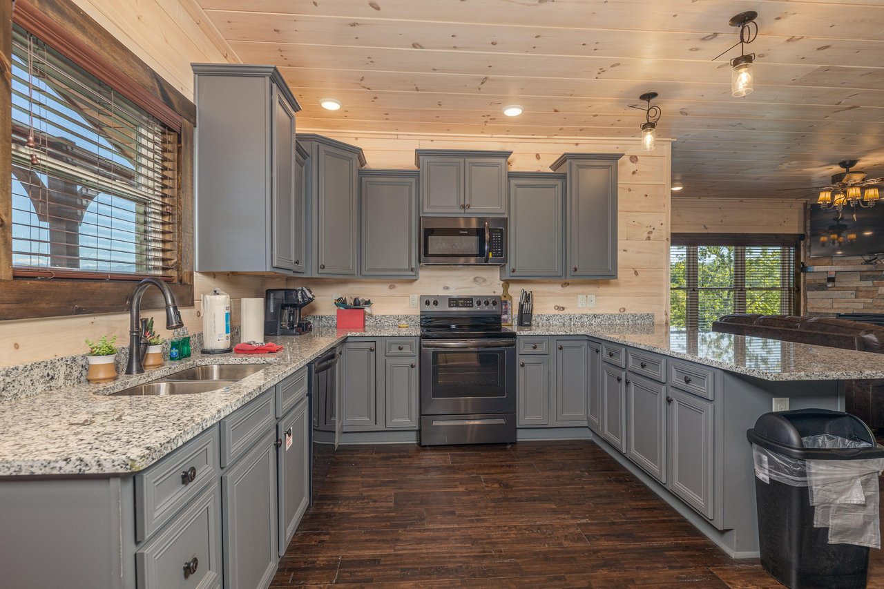 Full kitchen with gray cabinets