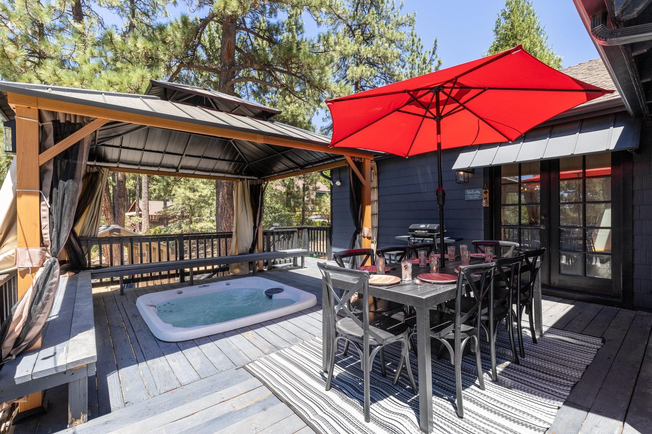 Private covered hot tub and outdoor dining.