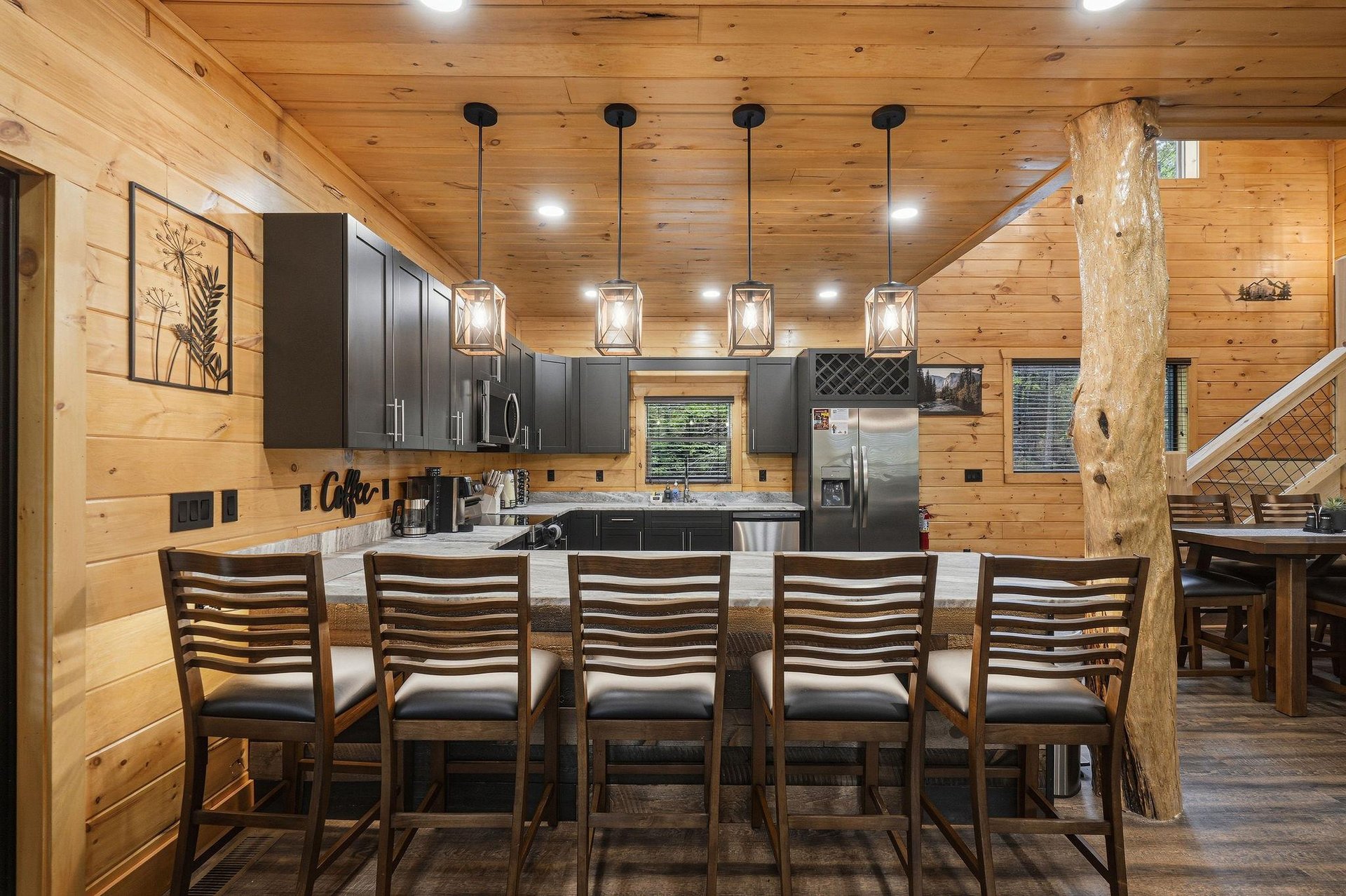 Gather around your rustic kitchen island where warm wood meets modern style—perfect for morning coffee or evening meals together.