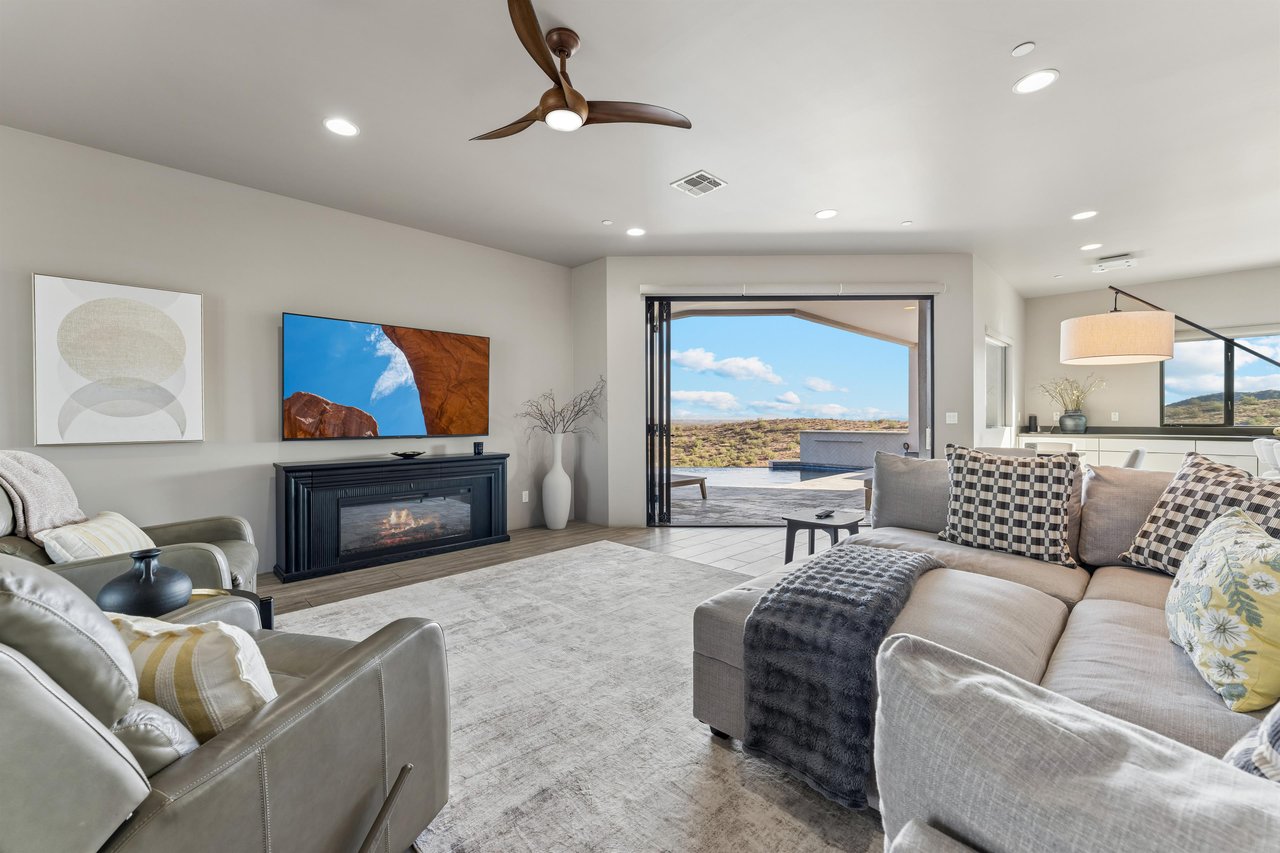 Large sliding doors, flatscreen TV, ample seating, mountain views.