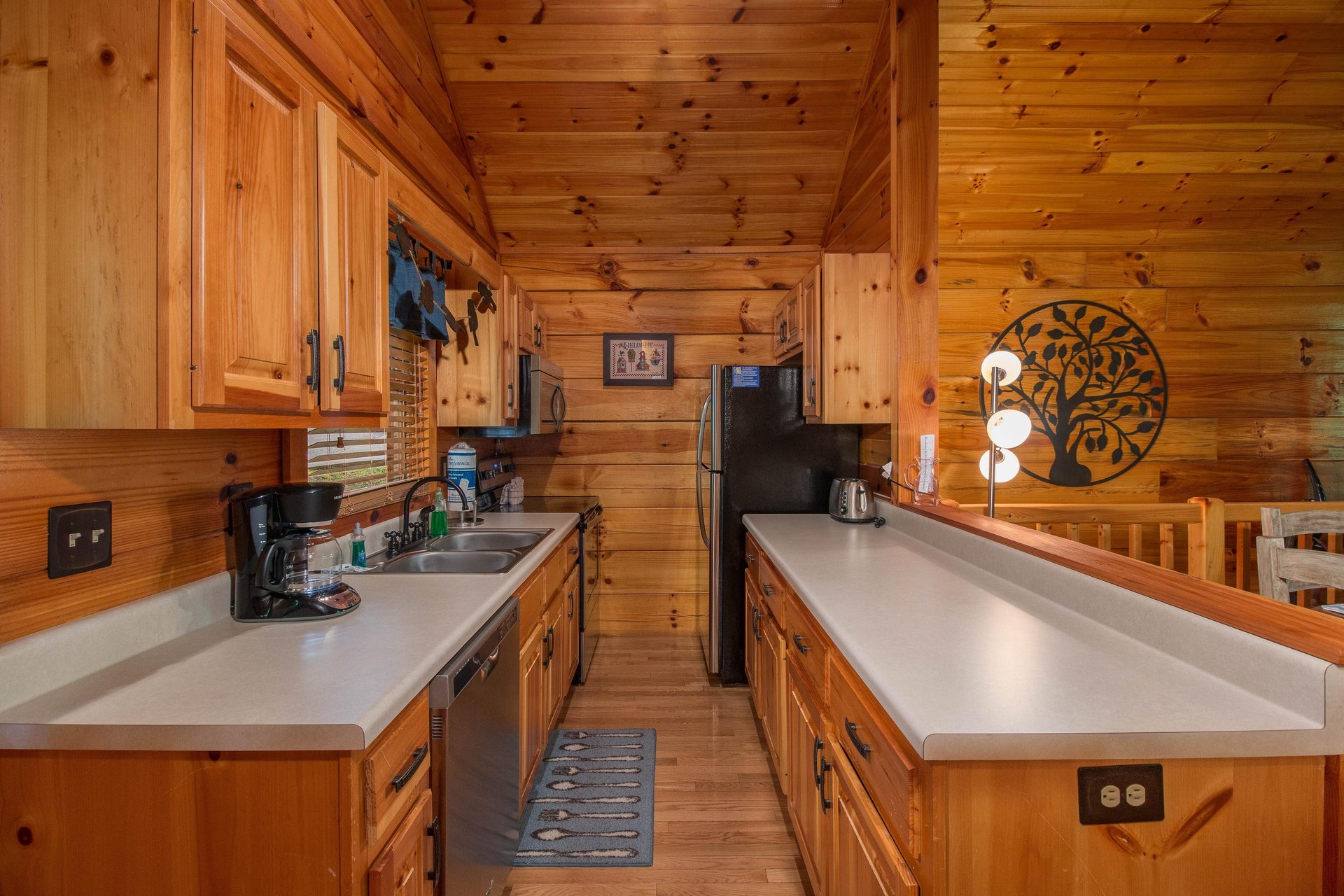 Galley kitchen at Kellys Cabin, a 1 bedroom cabin rental located in Pigeon Forge