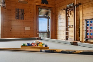 Challenge your group to a friendly game of pool in this warm, woodpaneled retreat complete with rustic charm and mountain lodge appeal.