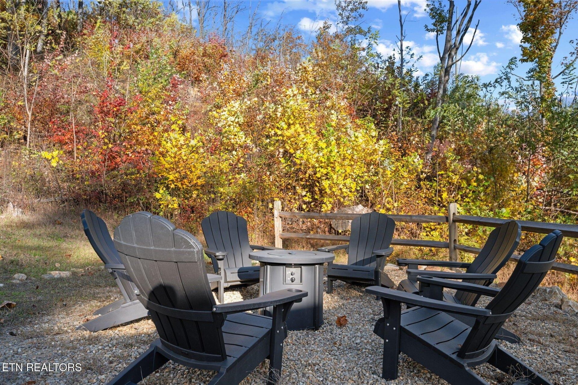 Gather around the fire pit and let autumns vibrant colors surround you—a perfect spot to unwind with loved ones under the open sky.