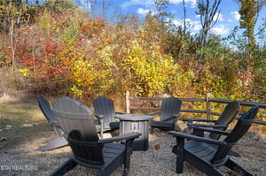 Gather around the fire pit and let autumns vibrant colors surround you—a perfect spot to unwind with loved ones under the open sky.