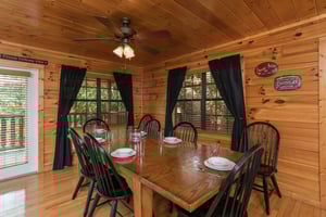 Dining table for 8 Kick Back  Relax A 4 bedroom cabin rental located in Pigeon Forge