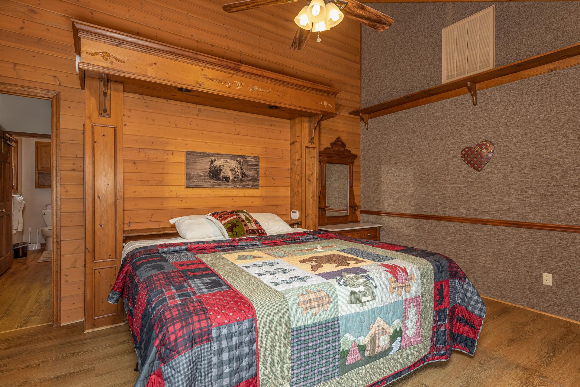King bed and night stand at Cubs Crib, a 3 bedroom cabin rental located in Gatlinburg