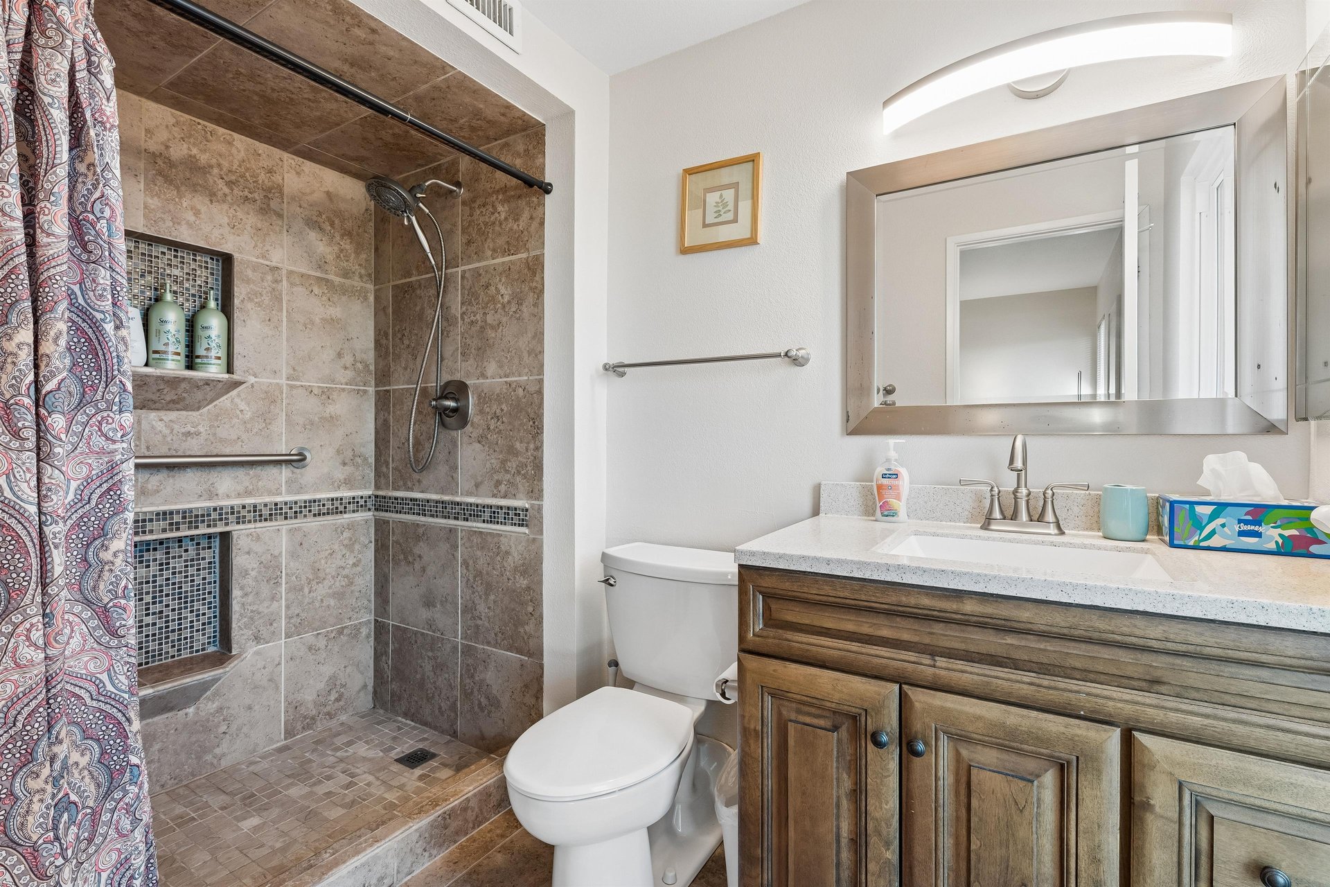 Ensuite bathroom with walkin shower and detachable showerhead.