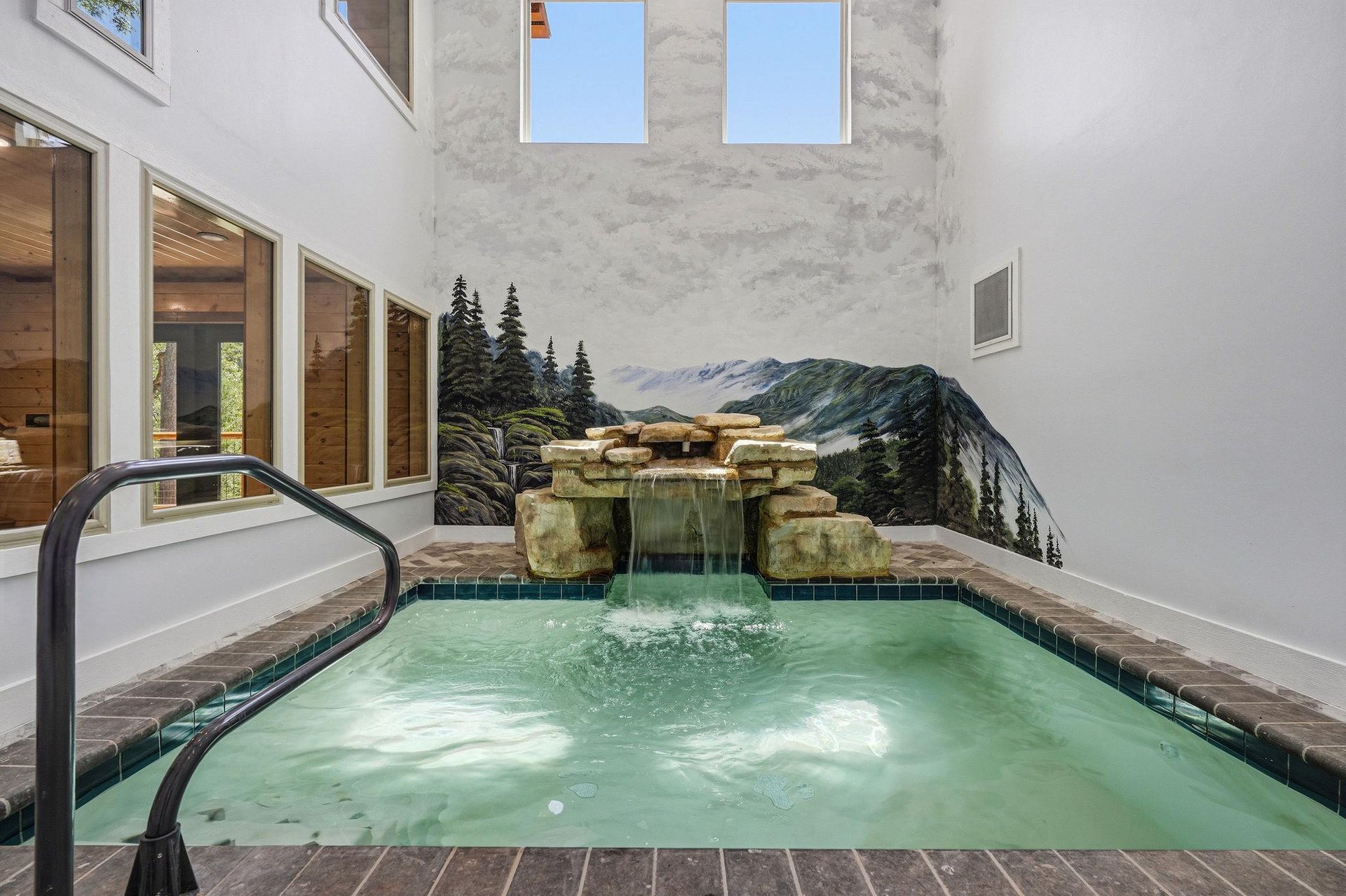 Soak away the day in your private indoor hot tub, where warm water and a calming mural create a peaceful spa retreat.