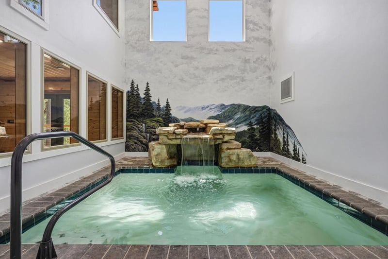 Soak away the day in your private indoor hot tub, where warm water and a calming mural create a peaceful spa retreat.