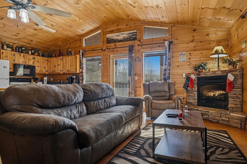 Cozy up in your rustic living room with plush leather seating and crackling fireplace.