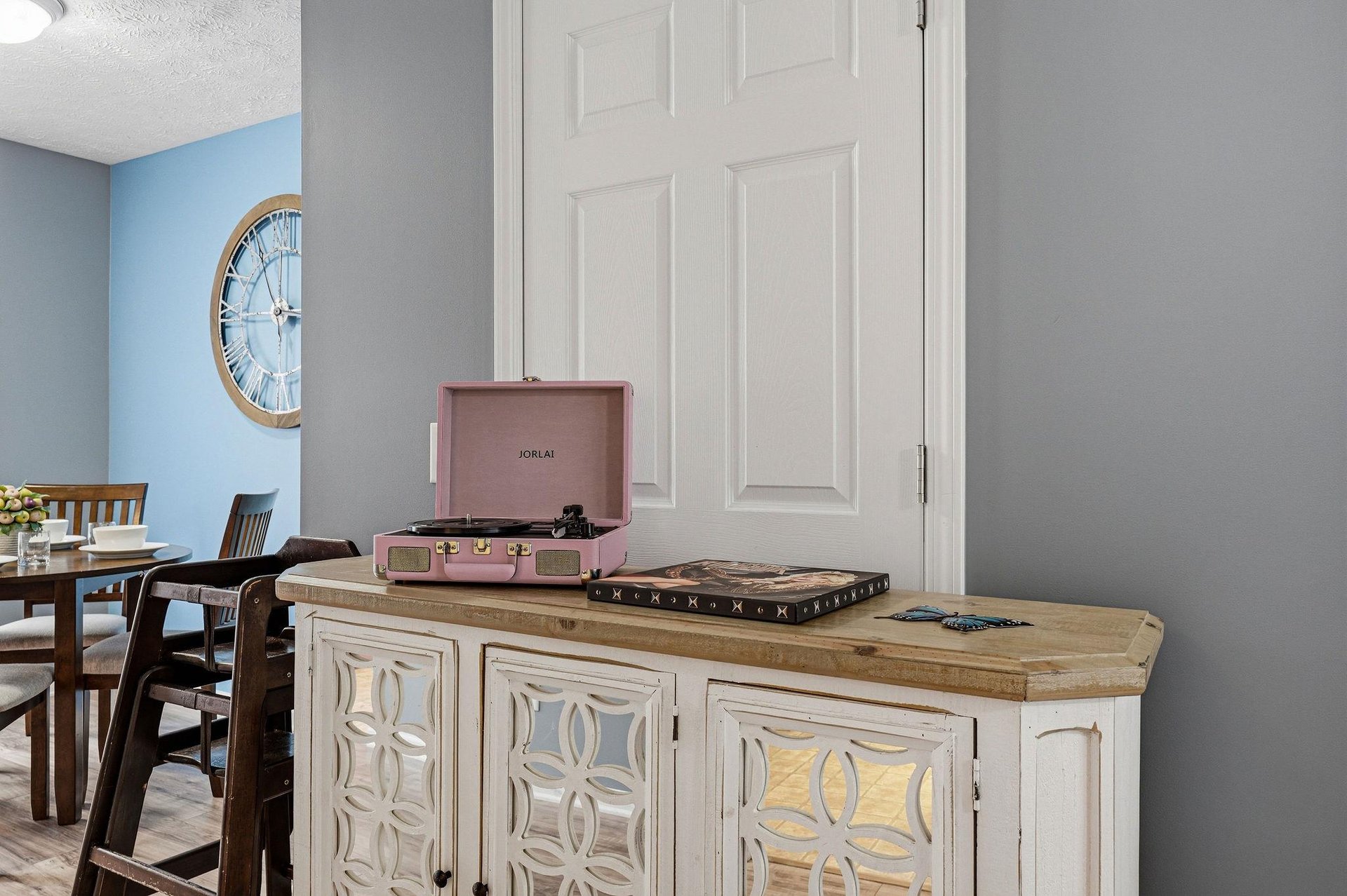 Enjoy vinyl records on your vintage turntable while relaxing in this thoughtfully designed living space.