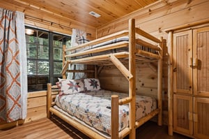 Cozy up in this charming bunk room with rustic log furniture, soft quilted bedding, and a warm pine interior that wraps you in cabin comfort.