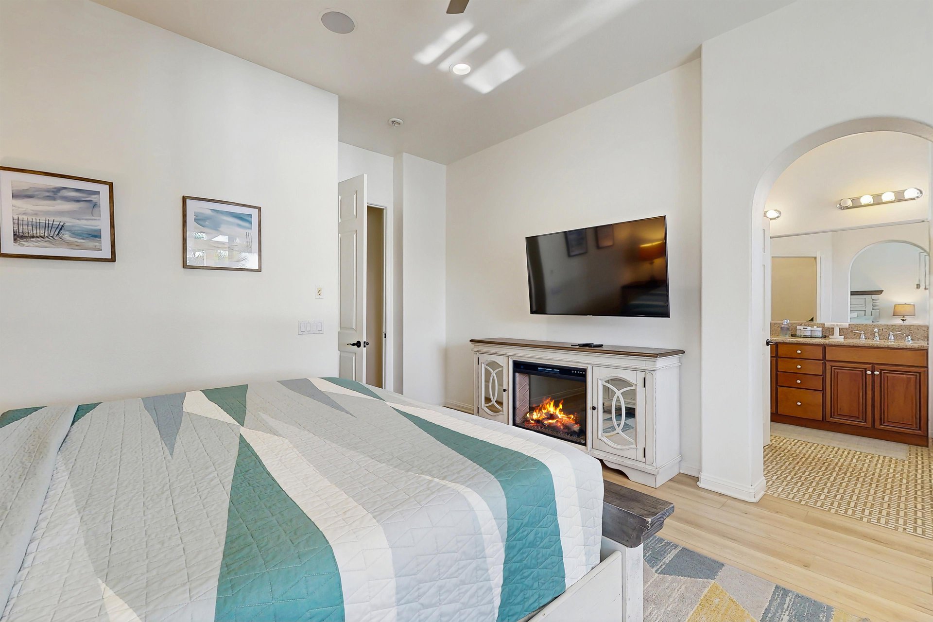 Flatscreen TV with streaming, gas fireplace, and en suite bathroom.