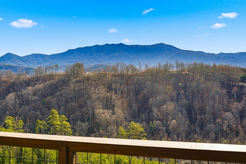 Breathtaking mountain vistas stretch across rolling hills from your private balcony, creating the perfect backdrop for morning coffee.