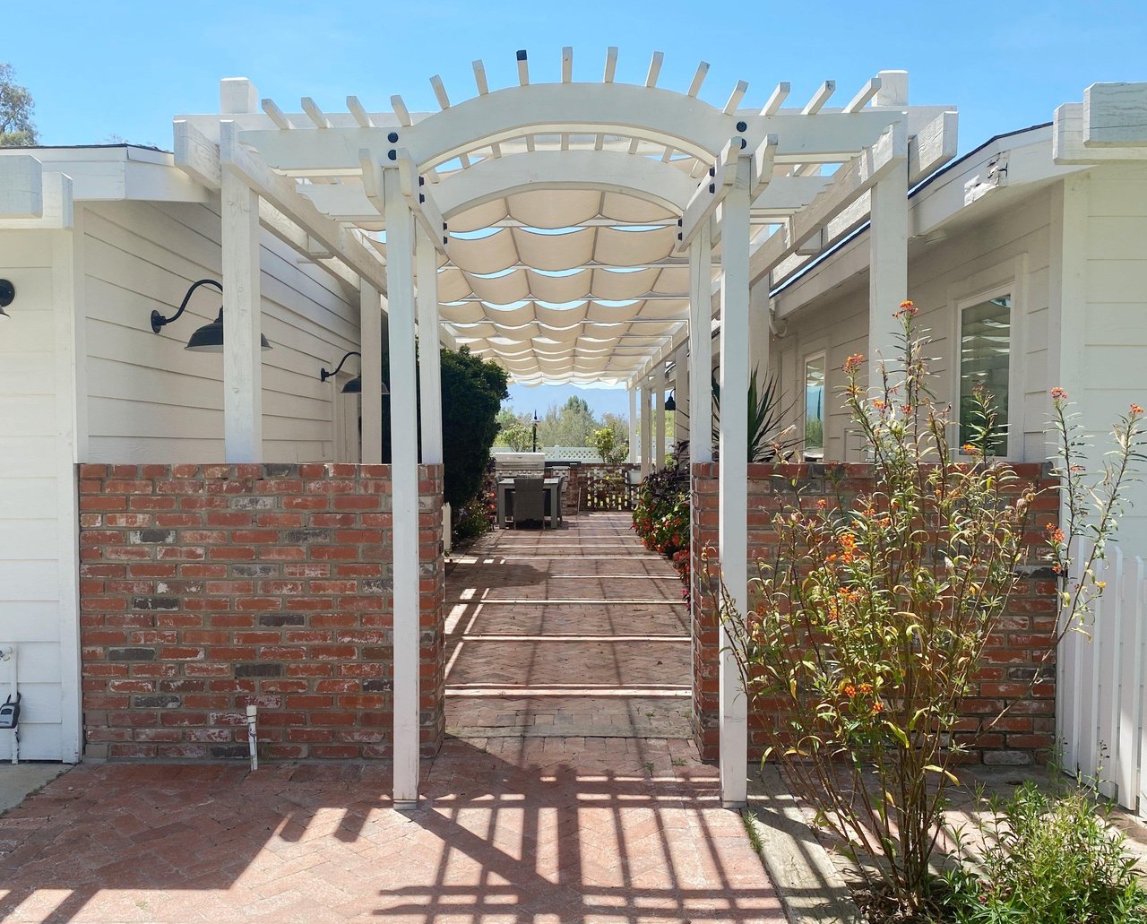 Grand flowerlined walkway leading to the front door.
