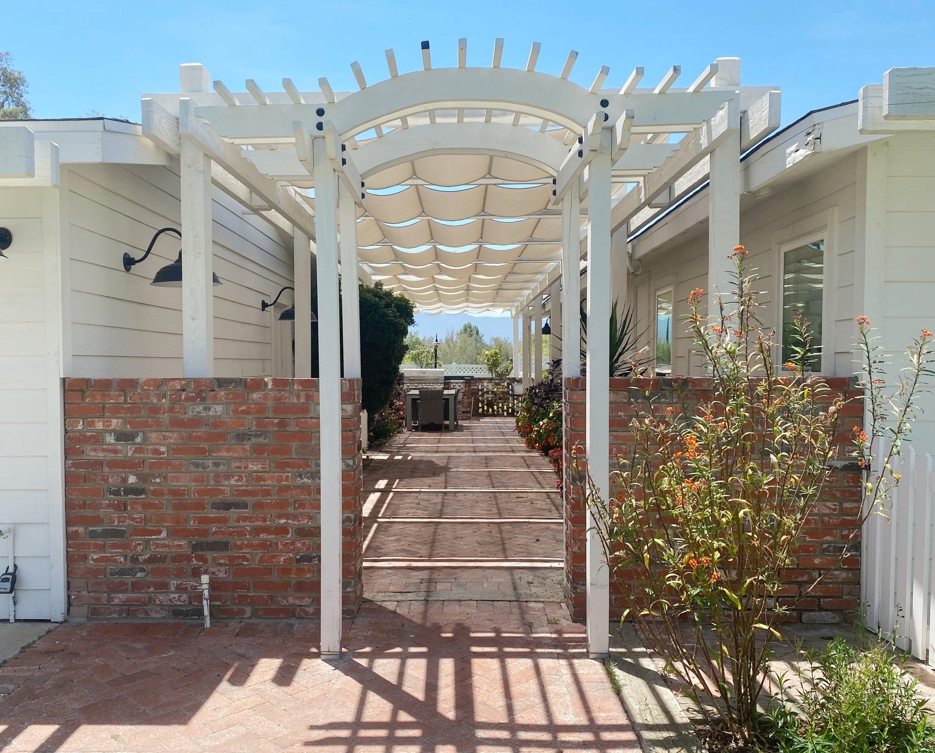 Grand flowerlined walkway leading to the front door.
