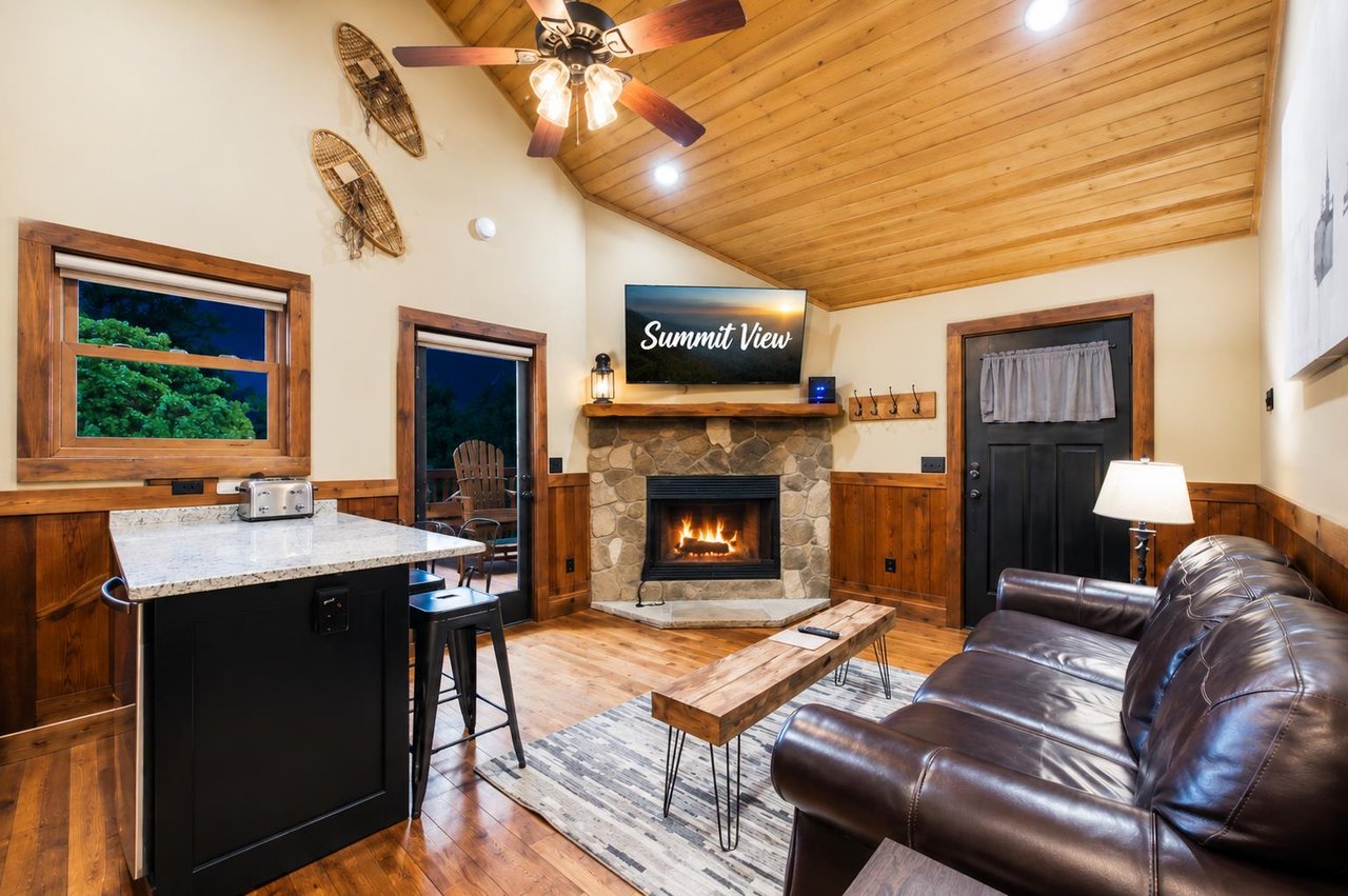 Open concept common area living room with sleeper sofa