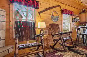 Sink into handcrafted log furniture while your coffee brews, surrounded by warm wood walls and mountain memories in this cozy cabin retreat.