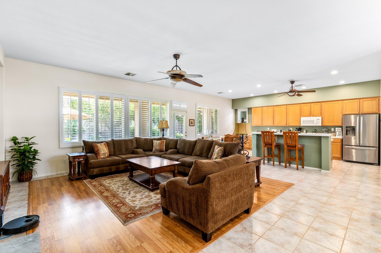 Ample seating, fireplace, flatscreen TV, and openconcept living space.