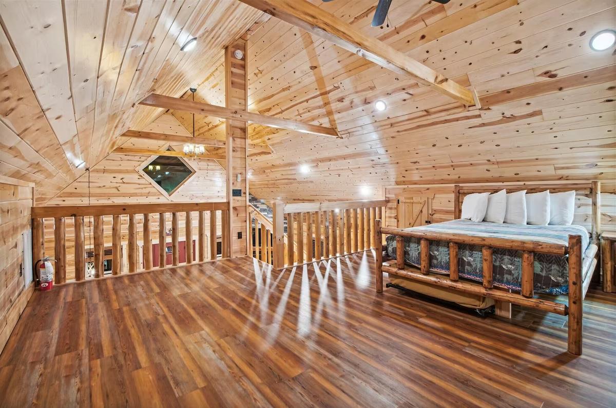 Your rustic loft bedroom features warm wood beams and cozy log bed frame for peaceful mountain retreat nights.