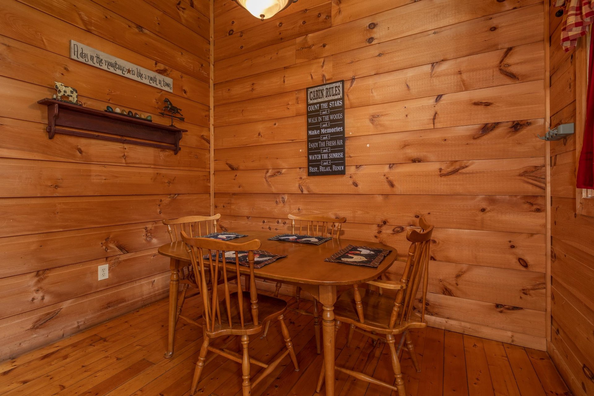 Dining table for four at Logans Smoky Den, a 2 bedroom cabin rental located in Pigeon Forge