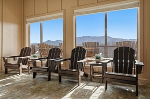 Settle into these Adirondack chairs and let your eyes drink in the sweeping mountain vistas through floortoceiling windows.
