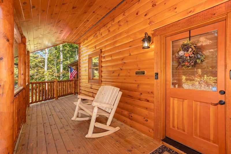Outdoor rocking bench by front door