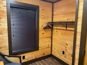 Handcrafted wood walls and modern details create a cozy retreat where you can unpack and settle in with ease.