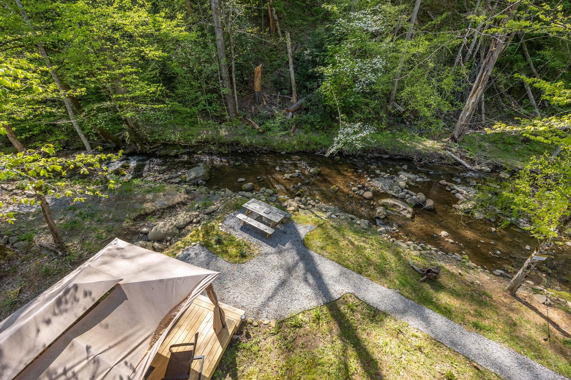 View of gazebo and picnic table near creek