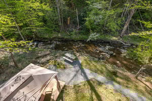 View of gazebo and picnic table near creek