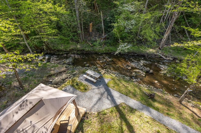 View of gazebo and picnic table near creek
