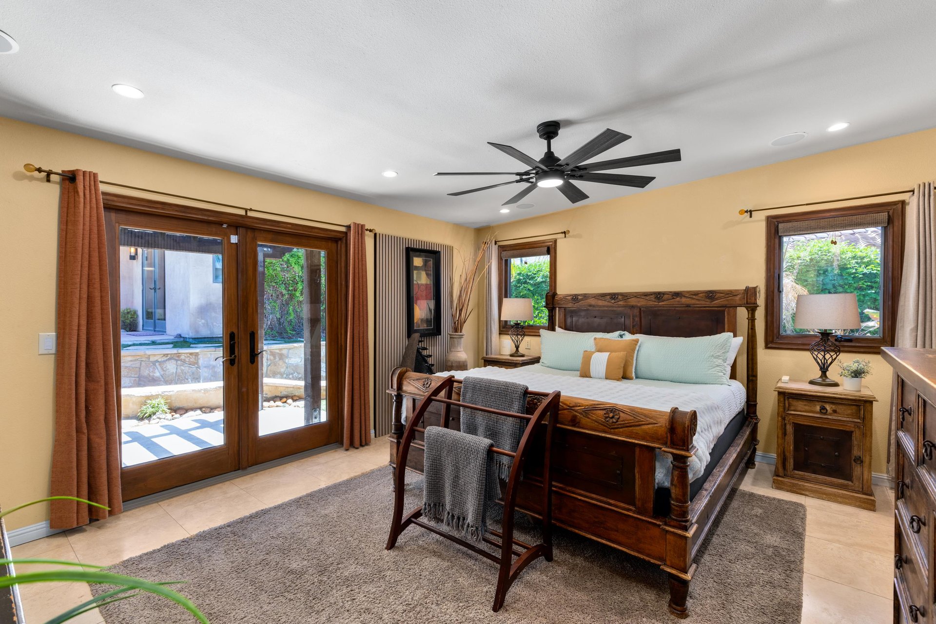 King size bed, patio access, flatscreen TV, and ensuite bathroom.