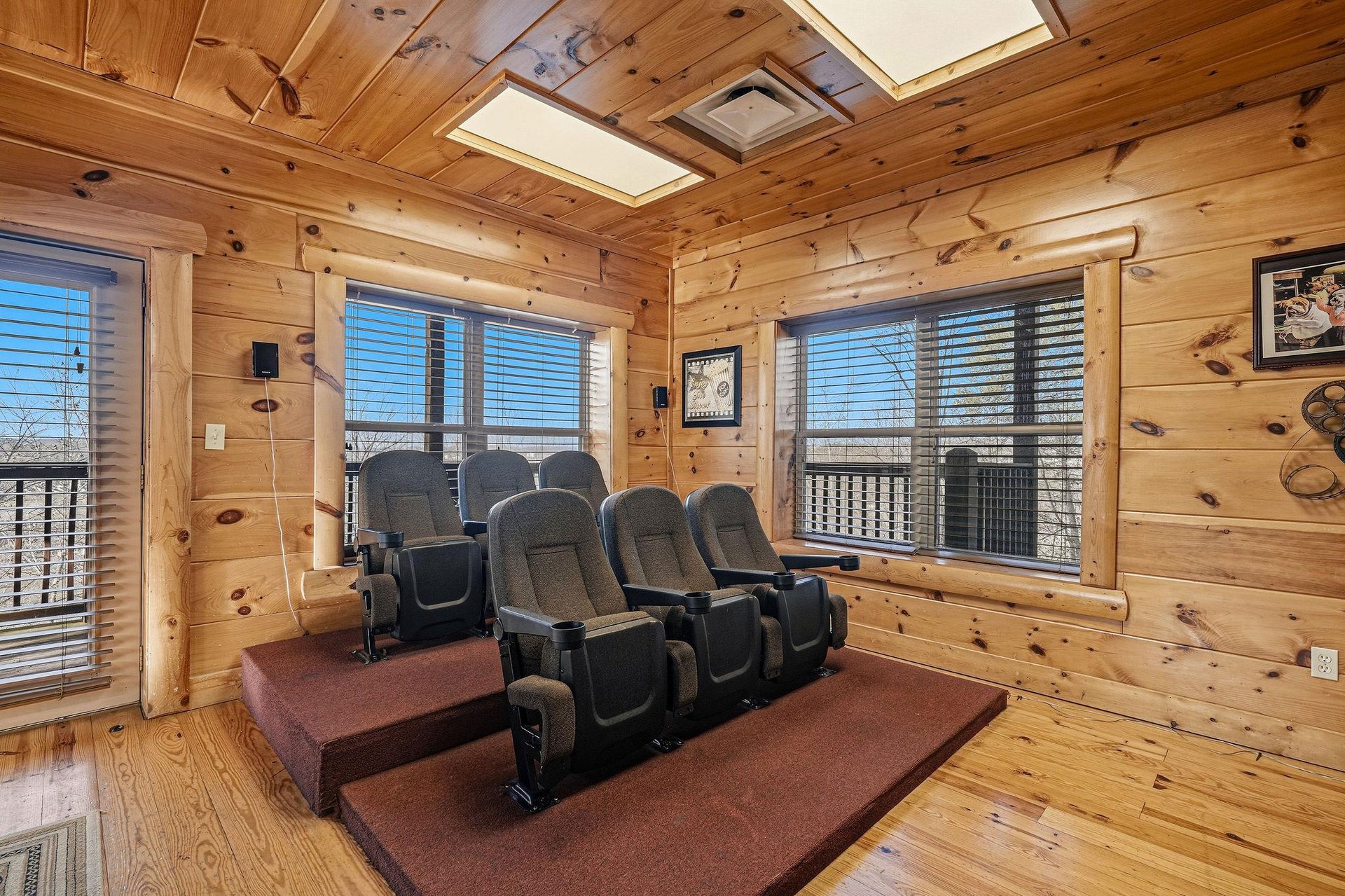 Settle into your private theater with plush recliners surrounded by warm knotty pine walls and skylights for the ultimate movie night experience.