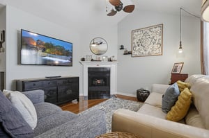 Sink into plush seating by the warm fireplace, enjoy your favorite shows on the large TV, and unwind in this cozy, thoughtfully decorated living space designed for your relaxation.