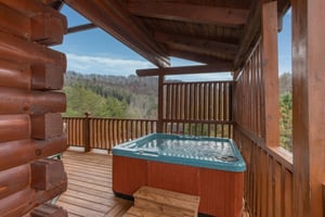 Hot tub and privacy lattice at Hibernation Station, a 3bedroom cabin rental located in Pigeon Forge
