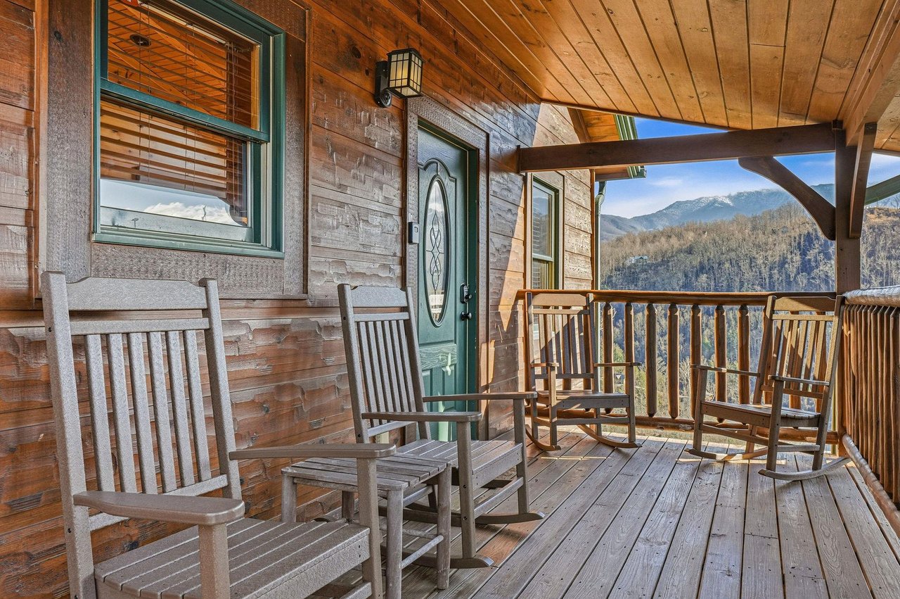 Unwind on your private covered porch with rocking chairs, where morning coffee tastes better with stunning mountain views.