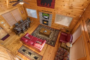 Looking down at the living room at Graceland, a 4bedroom cabin rental located in Pigeon Forge