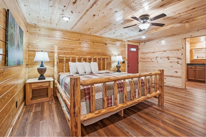 Relax in your rustic retreat with handcrafted log furnishings and cozy quilted bedding surrounded by warm cedar walls.