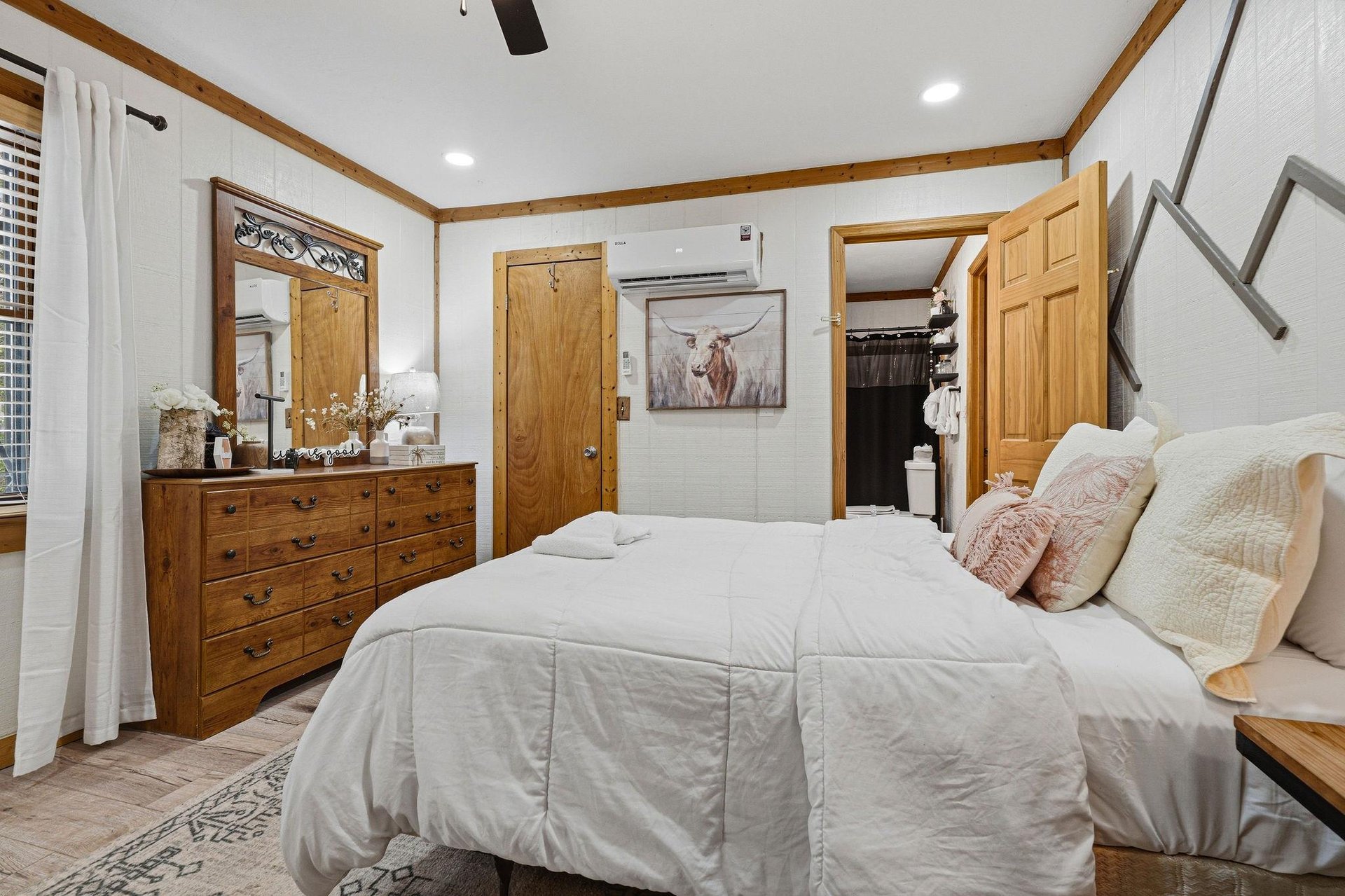 Sink into your cozy retreat with warm wood accents and soft linens welcoming you home after your adventures.