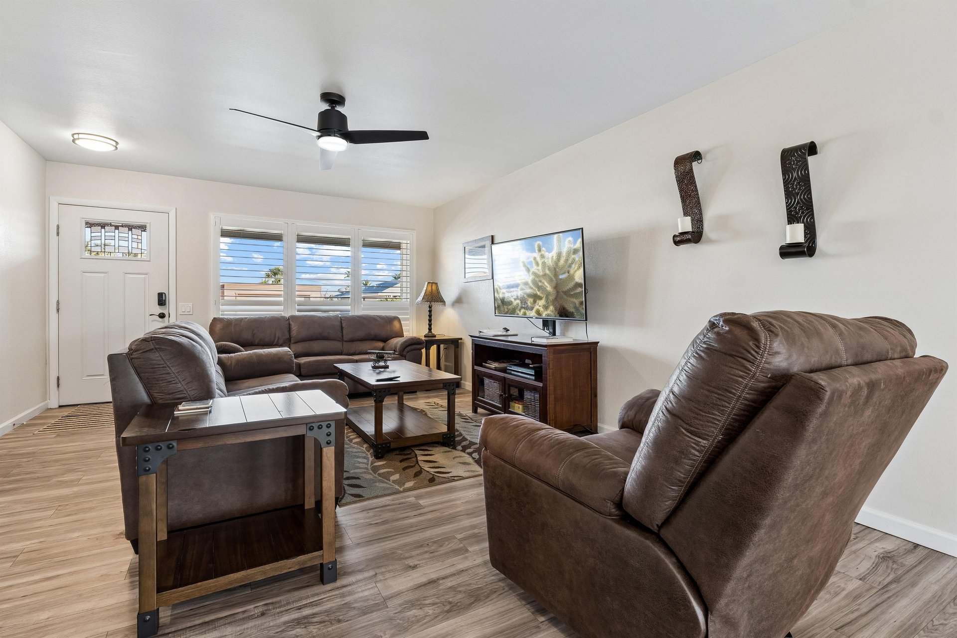 Features a flatscreen TV with streaming, pullout couch for additional sleeping space, and openconcept floor plan.