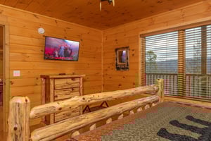 Dresser and TV in a bedroom at Js Hideaway, a 4 bedroom cabin rental located in Pigeon Forge
