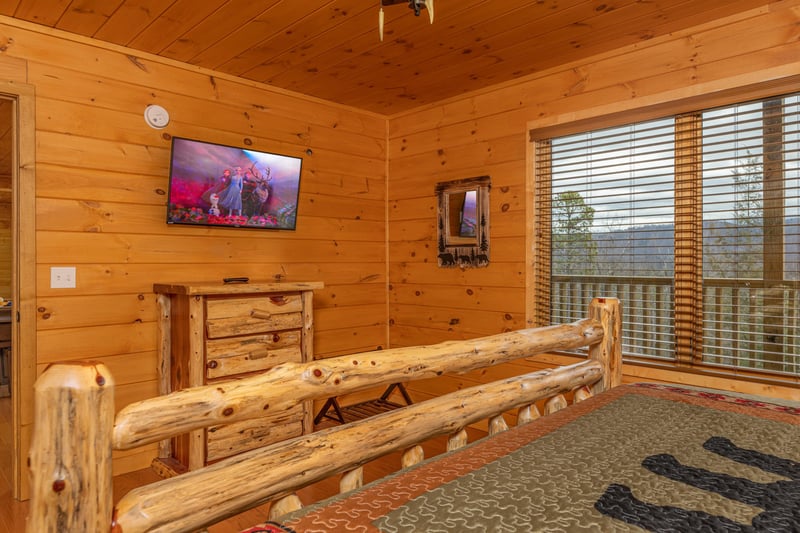 Dresser and TV in a bedroom at Js Hideaway, a 4 bedroom cabin rental located in Pigeon Forge