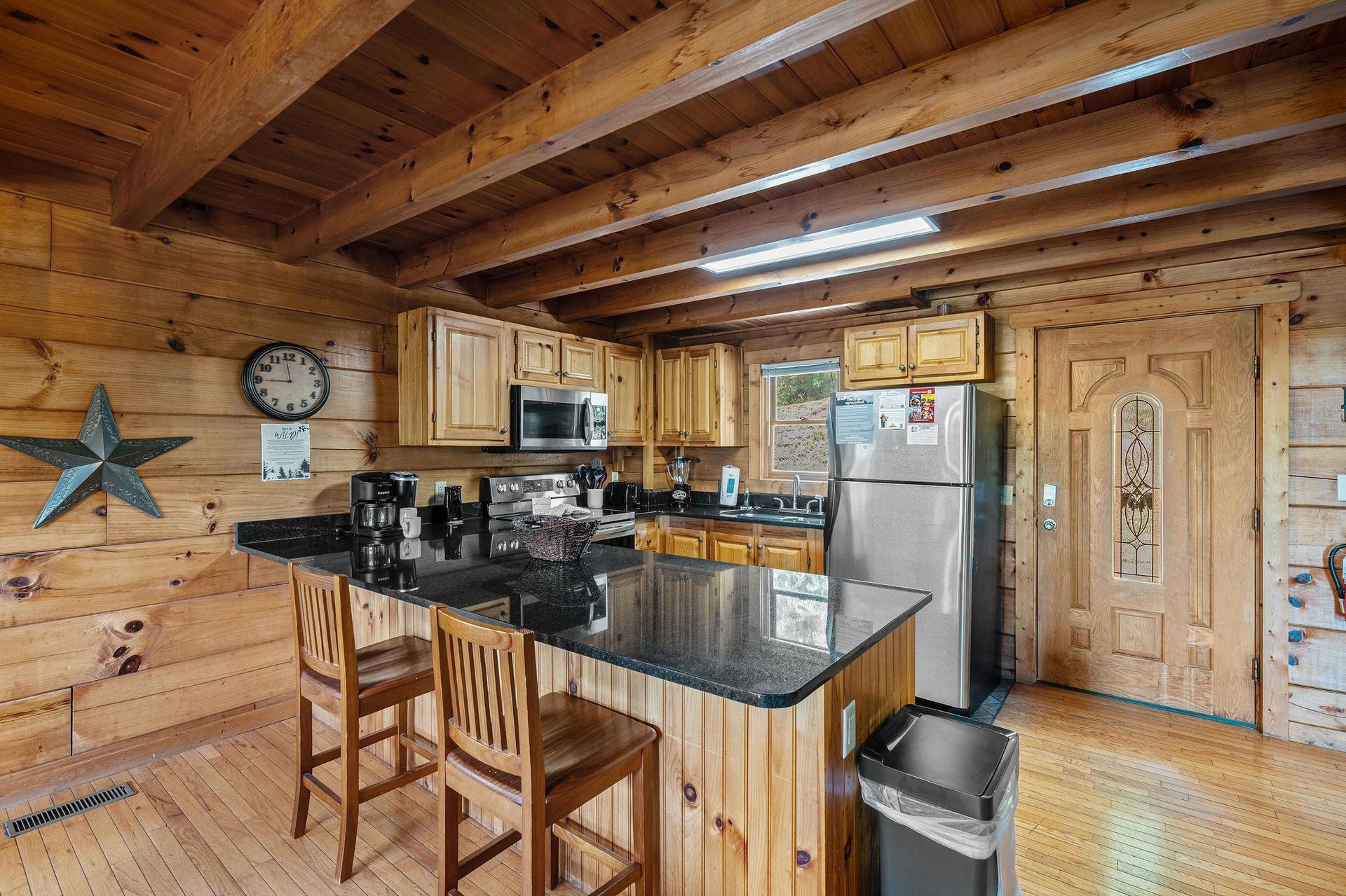 Open kitchen with counter and cabinets