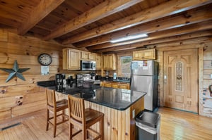 Open kitchen with counter and cabinets