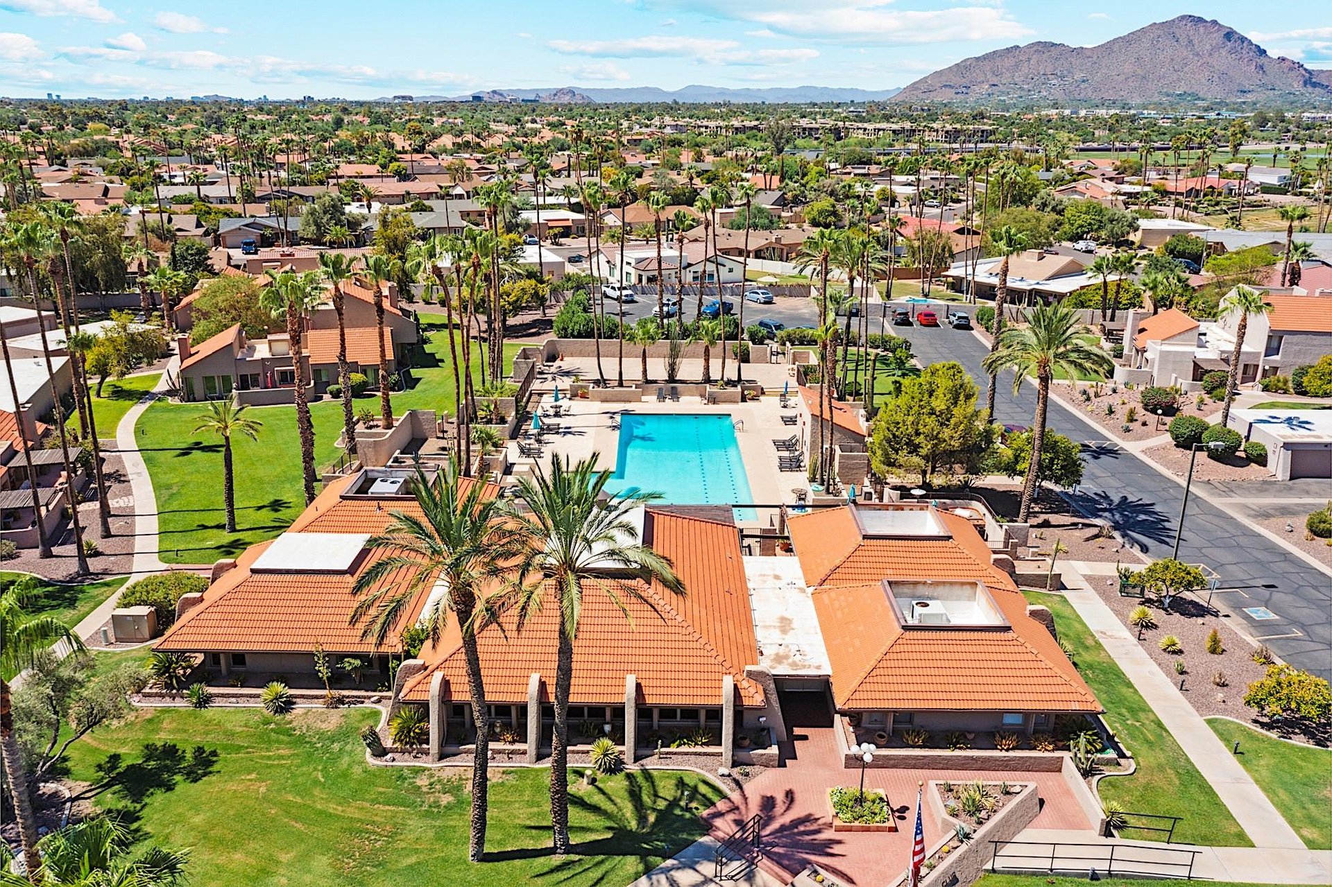 Aerial view of the heated community pool, spa and clubhouse.